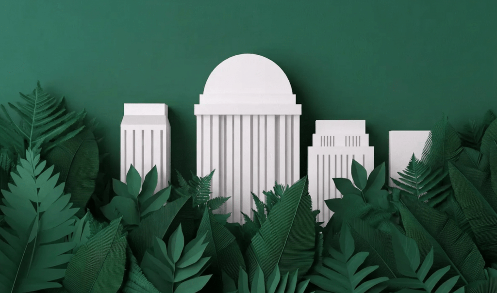 White paper-like buildings nestled among lush green leaves against a deep green background, creating a modern and artistic urban jungle.