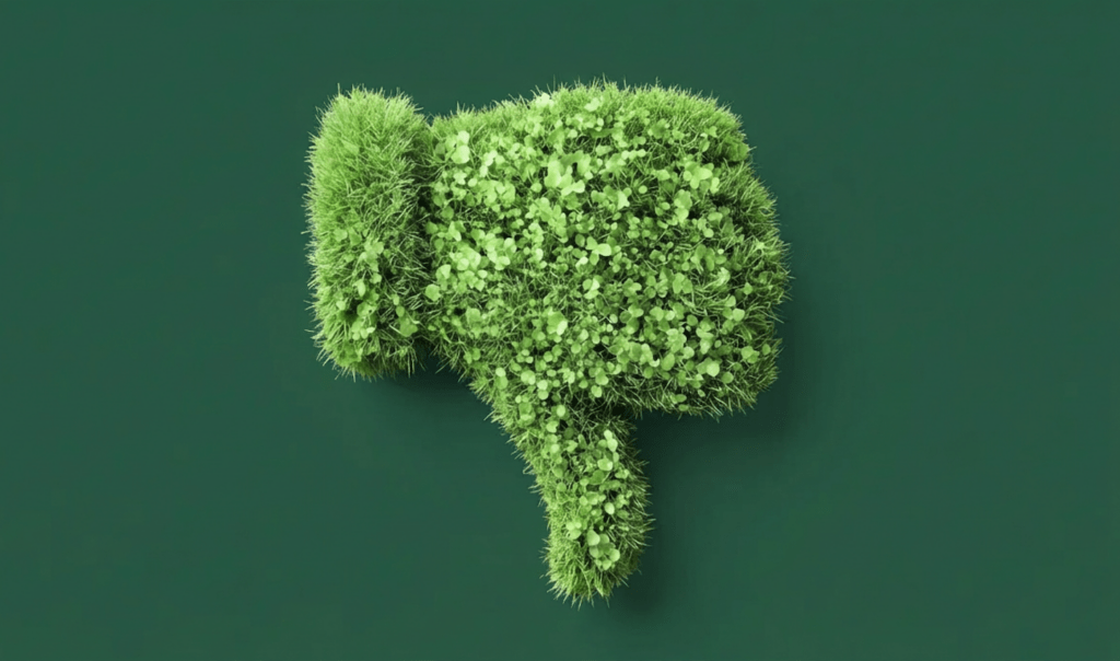 A green, leafy thumbs-down symbol made of grass and small plants, set against a dark green background.