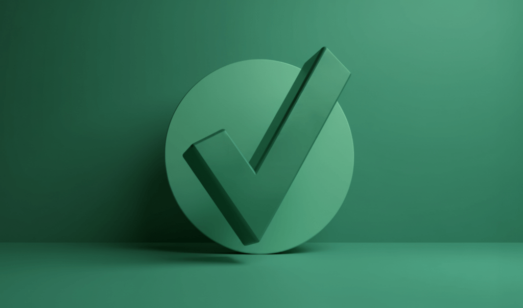A three-dimensional green checkmark icon stands on a circular base against a matching green background.