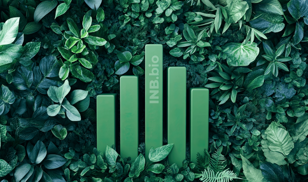 Green bars rise amidst a lush arrangement of various green leaves, featuring the text "INB.bio" subtly integrated into the design.