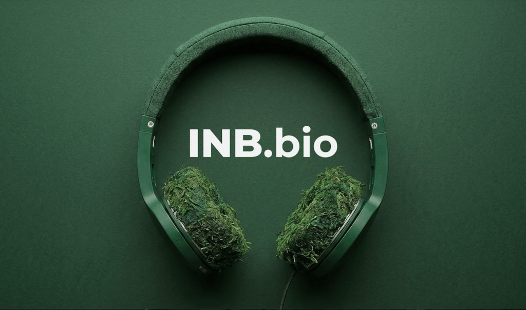Green headphones with ear cushions covered in moss, set against a matching green background with the text "INB.bio" in white.