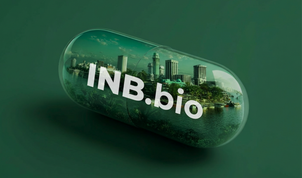 Clear capsule with a cityscape inside and the text "INB.bio" on a dark green background.