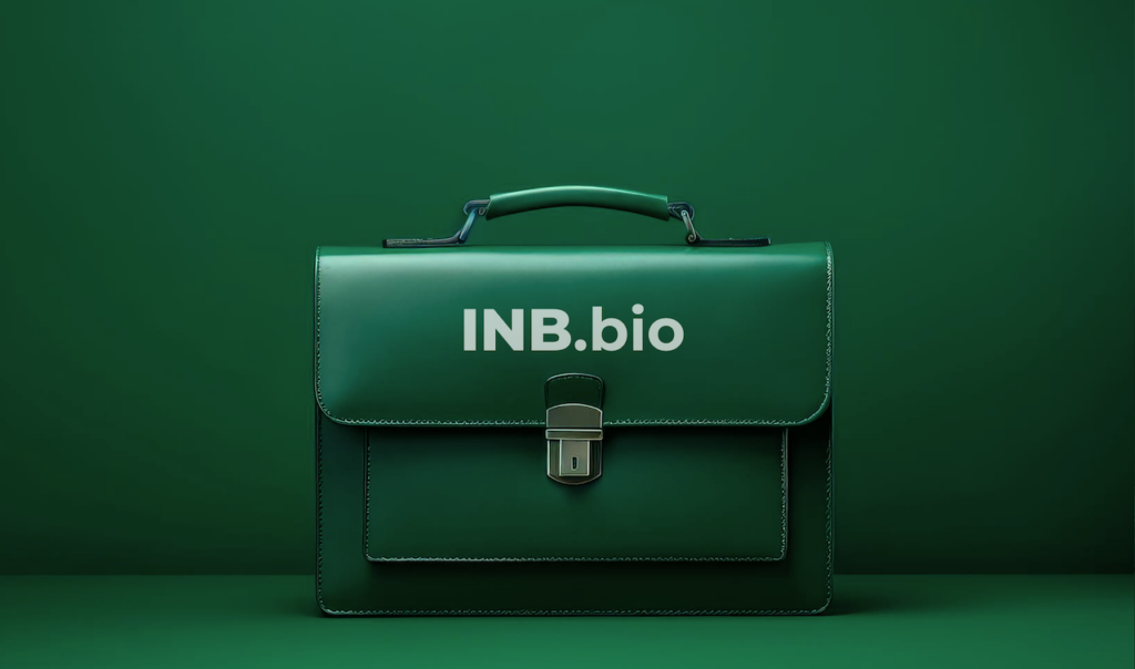 Dark green leather briefcase with metal clasp and "INB.bio" text on the flap, set against a matching green background.
