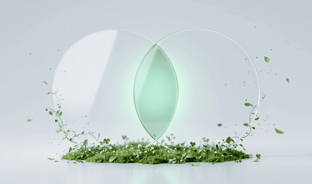 Two overlapping transparent circles glowing green at the center, surrounded by floating leaves and clover on green moss.
