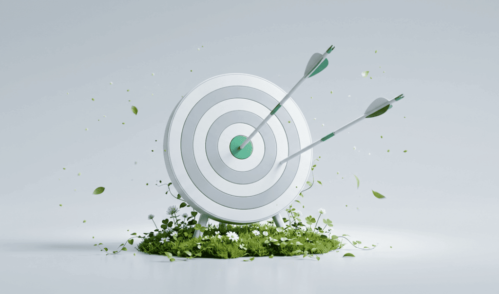 Archery target with two arrows hitting the bullseye, surrounded by green grass, white flowers, and floating leaves on a light gray background.