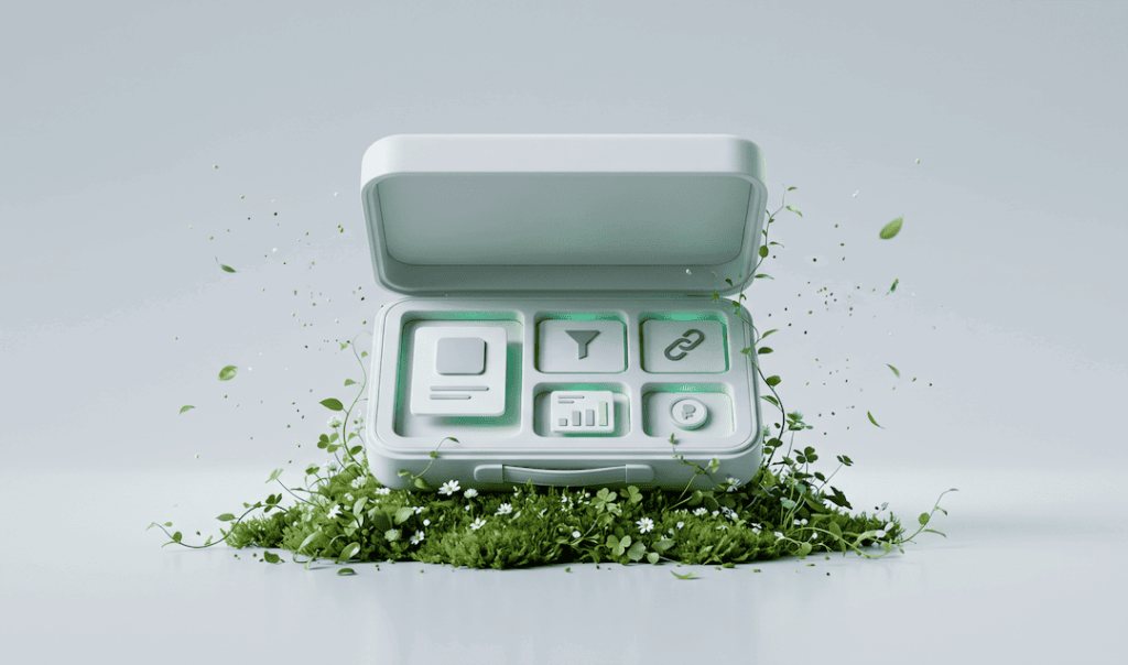 Open gray toolbox with digital interface icons inside surrounded by grass, small flowers, and floating green leaves.