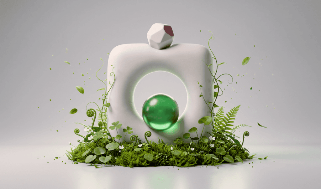 White abstract hollow sculpture with a green glass sphere inside, surrounded by lush green plants and small white flowers on a gray background.